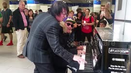 Men stun travellers by performing epic piano duet in London tube station