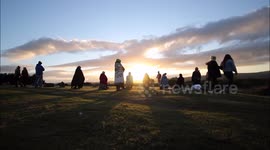 Druids gather at Beaghmore Stone Circles during summer solstice sunset