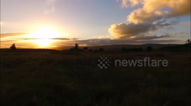 Drone view of summer solstice sunset at Beaghmore Stone Circles