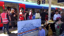 Crowds of racegoers descend on Ascot train platform on Ladies Day