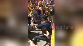 Australian fan performs ‘shoey’ from moon boot after Australia draw with Denmark