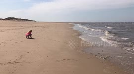 My children enjoying fun on the beach in Wales.