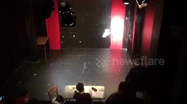 Theatre actor trips and falls on stage