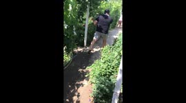 Adults having water gun fight