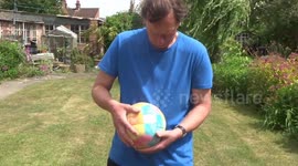 Man solves Rubik's Cube Football