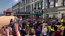 Poland and Colombia fans having a chant face-off before match