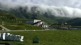 Fog rolls over mountains in southwest China