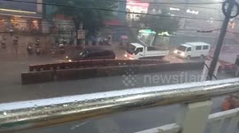 Barrier Floating Down Flooded Road Looks Like Huge Centipede