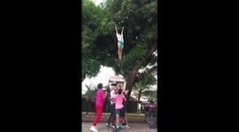 Cheerleading squad tosses friend into air to retrieve tasty mangoes