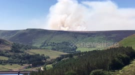 Fire sends huge plume of smoke into skies over Saddleworth Moor