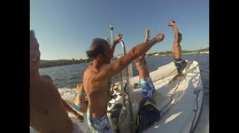 Cool american football pass on speedboat driven by Emanuele Pirro