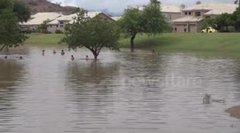 Arizona floods turn a playground into a swimming pool