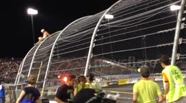 NASCAR fan climbs security fence during race