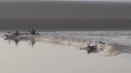 Surfers ride the Severn Bore