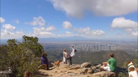 Bride saves groom from falling off a cliff