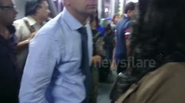 Passengers force open the door and are now protesting from outside Air India flight 315