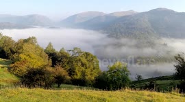 Mist rising over Grasmere Lake in the Lake District, UK