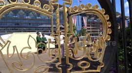 Grand Stand view through the gilded Royal Crown emblem on the Royal Ascot gates