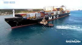 Tugboat pushing Transport ship at Freeport port
