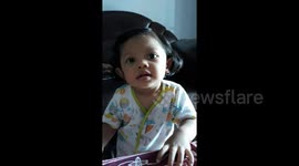 toddler skillfully mimics the nature of parents and their families