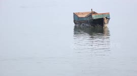 Small boat floating on the ocean.