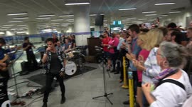 Jamie Cullum puts jazz slant on 'C'mon England!' chant as he surprises commuters with set at King's Cross station