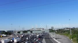 Dartford bridge traffic south side with blue sky by Jim Connor