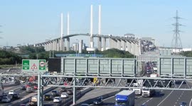 hand held Dartford bridge traffic south side with blue sky by Jim Connor