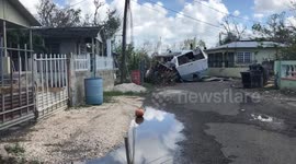 Boat and debris in Puerto Rican community after Hurricane Maria