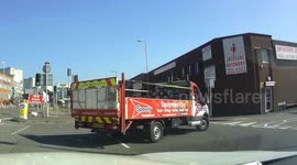 Motorcyclist ends up in truck's bed after side-on collision