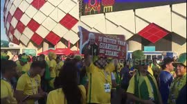 Brazil fans jump and chant outside Moscow's Spartak stadium before team faces off against Serbia