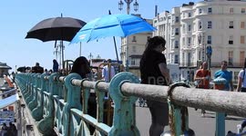 90F sunshine UK heatwave Brighton beach scenes