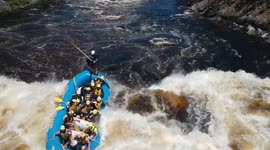 White-water rafting guide gets tossed out of boat after hitting big wave