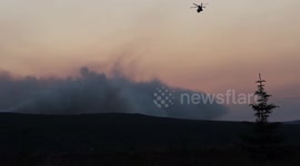 Helicopter Flies Out To Dusk Gorse Fire