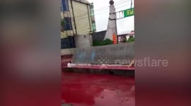 River turns blood-red due to leak at mineral waste warehouse