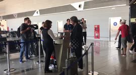 Germany coach waves to camera before boarding flight in Moscow
