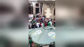Ecstatic Mexico fans hoist up Korean fan after South Korea win