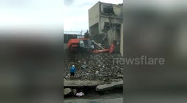 Lucky escape as digger rolls over with workman inside