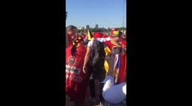Belgian 'Red Devils' fans dance to traditional music outside Kaliningrad Stadium