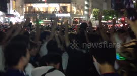 Japanese soccer fans in Tokyo celebrate World Cup advance