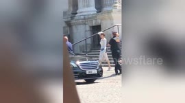 Angelina Jolie waves to fans after attending St Paul's Cathedral service