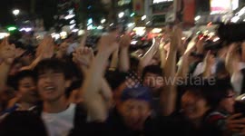 Sea of Japanese fans celebrate team progress in Shibuya
