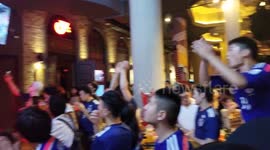 Here are Chinese people wearing Japan shirts leading the chants of