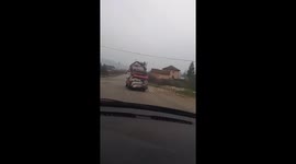 A crazy driver drives a car with a bunch of garbage through the main road