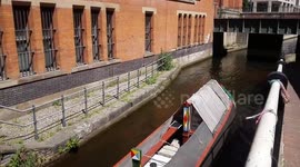 Barge through a city canal