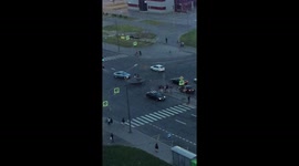 Teenagers bounce on trampoline in middle of busy road