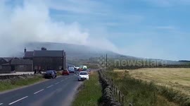 Road closed as plumes of smoke rise from another UK moor fire