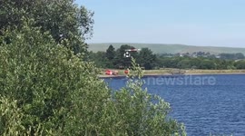 Helicopters assist firefighters tackling major blaze on Winter Hill, Bolton, Uk
