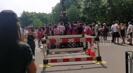London hottest day thirsty tourists saving monies topping up water at Green Park water fountain