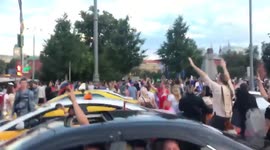 Muscovites climb out of their cars after win against Spain